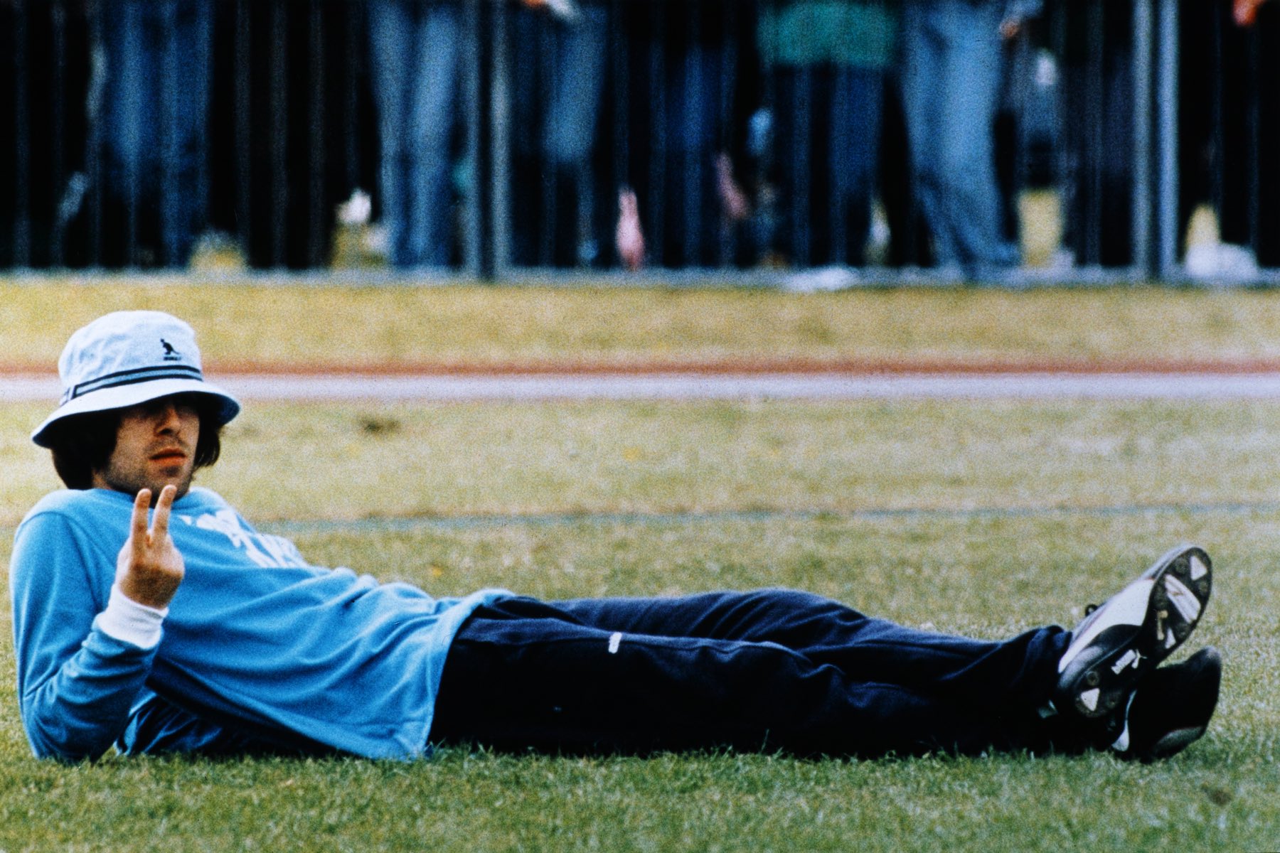 Liam Gallagher taking a break from notorious Blur vs. Oasis celebrity football match.